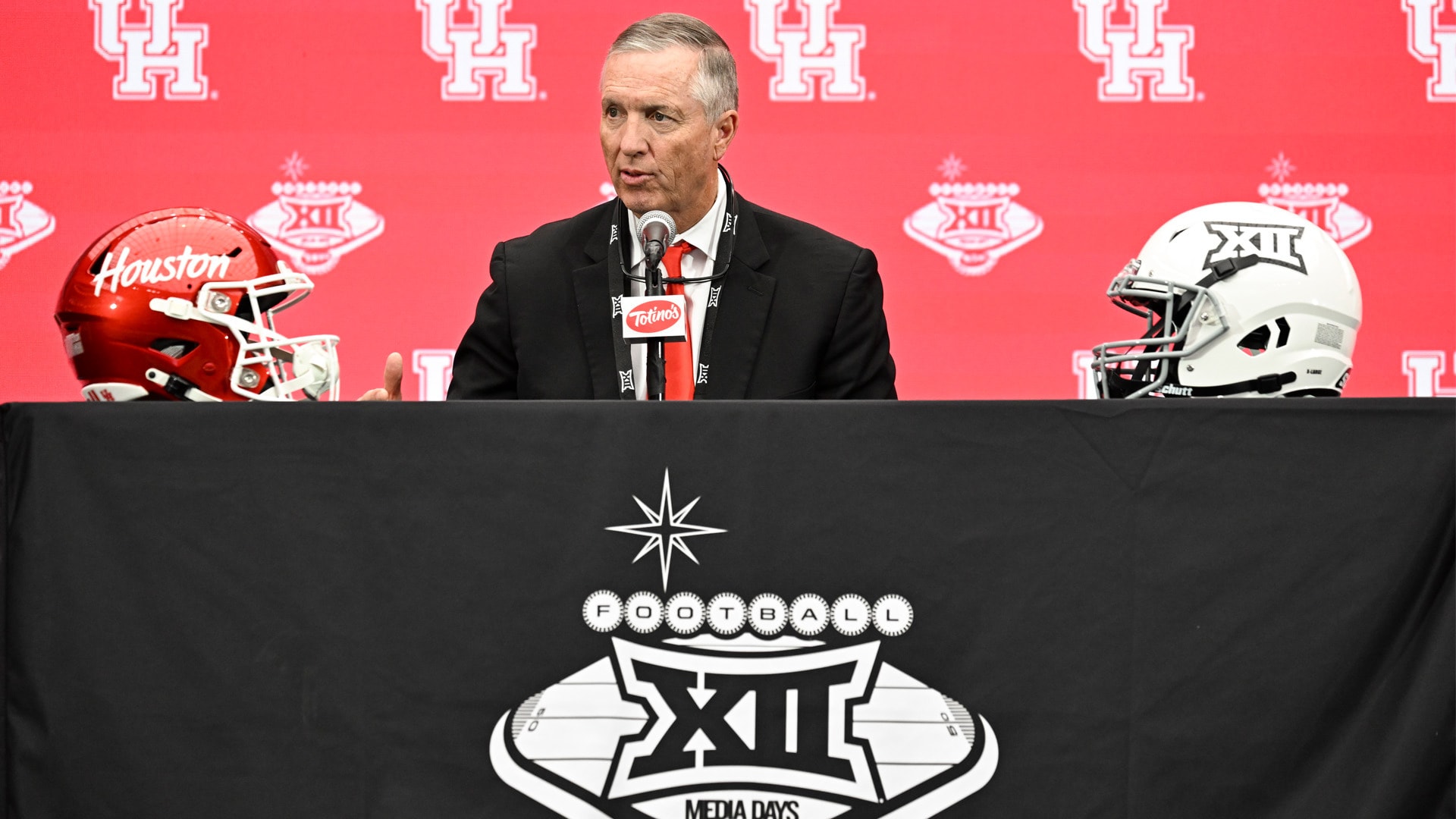 Coach Willie Fritz address members of the press